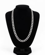 Silver tone curb chain necklace displayed on a black jewellery bust