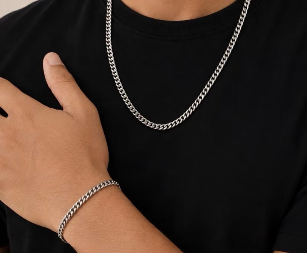Silver tone link chain necklace and bracelet worn together