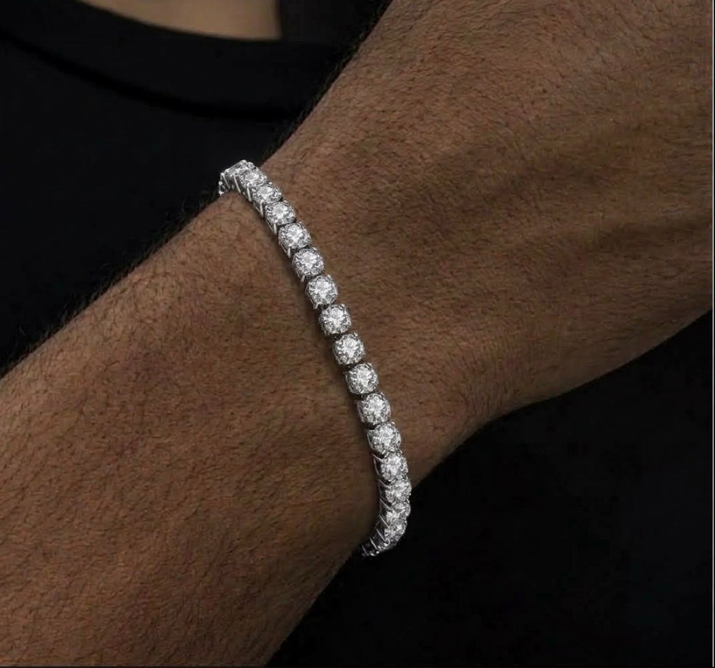 Close-up of a silver tone tennis bracelet with round clear stones