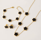 Black clover necklace, bracelet and stud earrings with gold tone settings