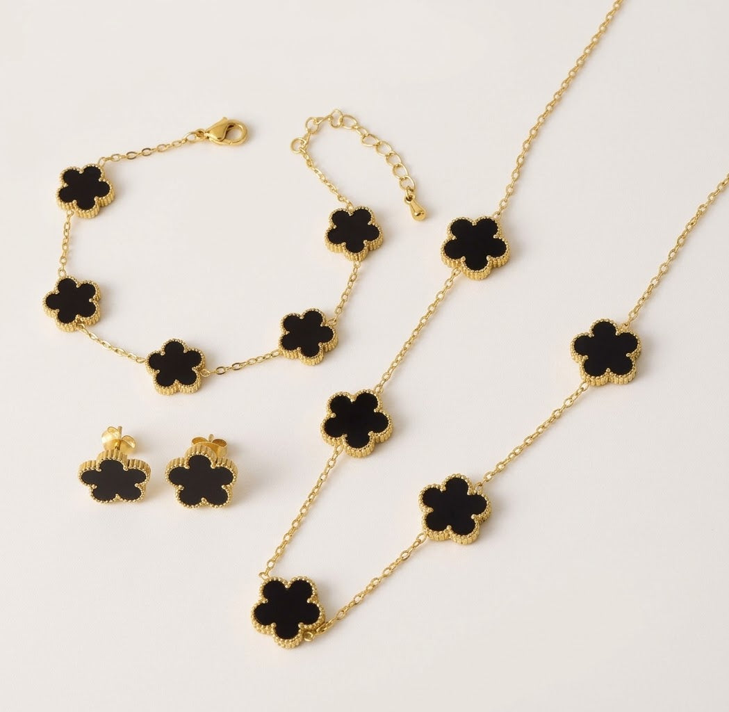 Black clover necklace, bracelet and stud earrings with gold tone settings