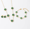 Green clover necklace, bracelet and stud earrings with gold tone settings