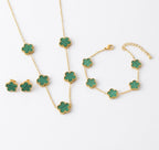 Green clover necklace, bracelet and stud earrings with gold tone settings