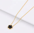 Black clover pendant with beaded edging on a gold tone chain