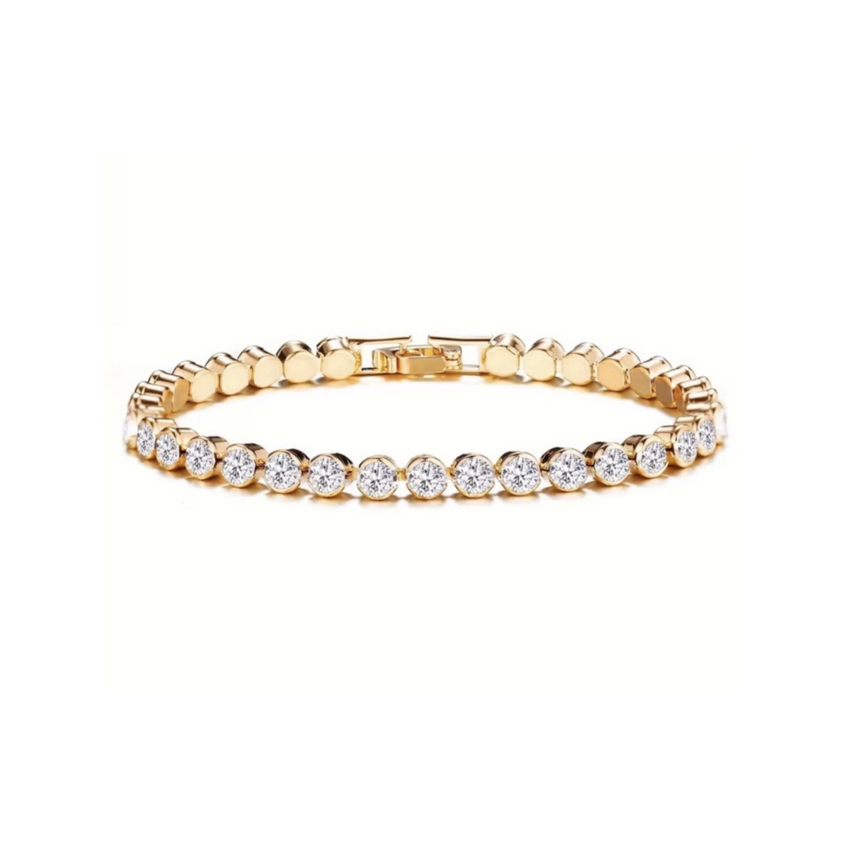 Gold tone tennis bracelet with round clear stones on a white background
